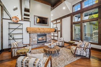 Resident lounge with multiple conversation areas and media